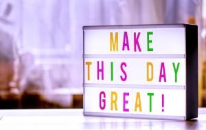 a sign saying 'make this day great'